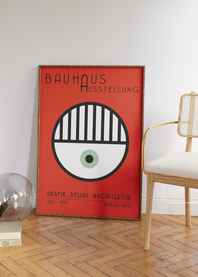 Das Bauhaus Poster zeigt dir auf rotem Hintergrund ein Auge.