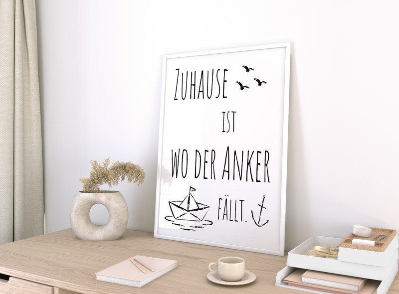 Schönes maritimes Poster mit einem Papierboot und dem Spruch Zuhause ist, wo der Anker fällt.