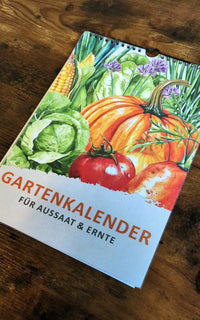 Ein hochwertiger Gartenkalender, der jeden Monat die Aussaat- und Erntezeiten übersichtlich darstellt. 