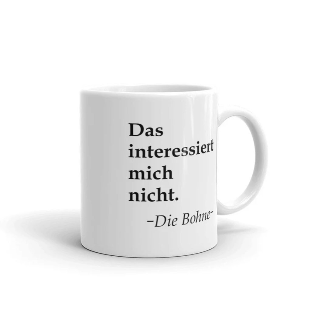 Dieses Tasse zeigt dir den witzigen Spruch " Das interessiert mich nicht. - Die Bohne". Die perfekte Tasse für deinen Schreibtisch.